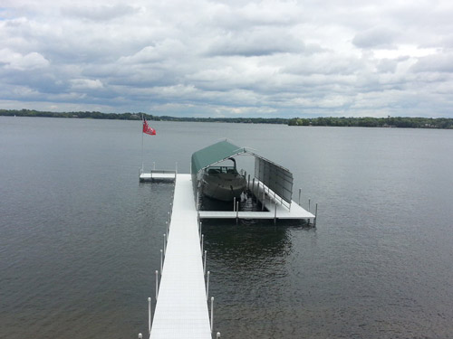 titan dock with green boathouse on Lake Minnetonka